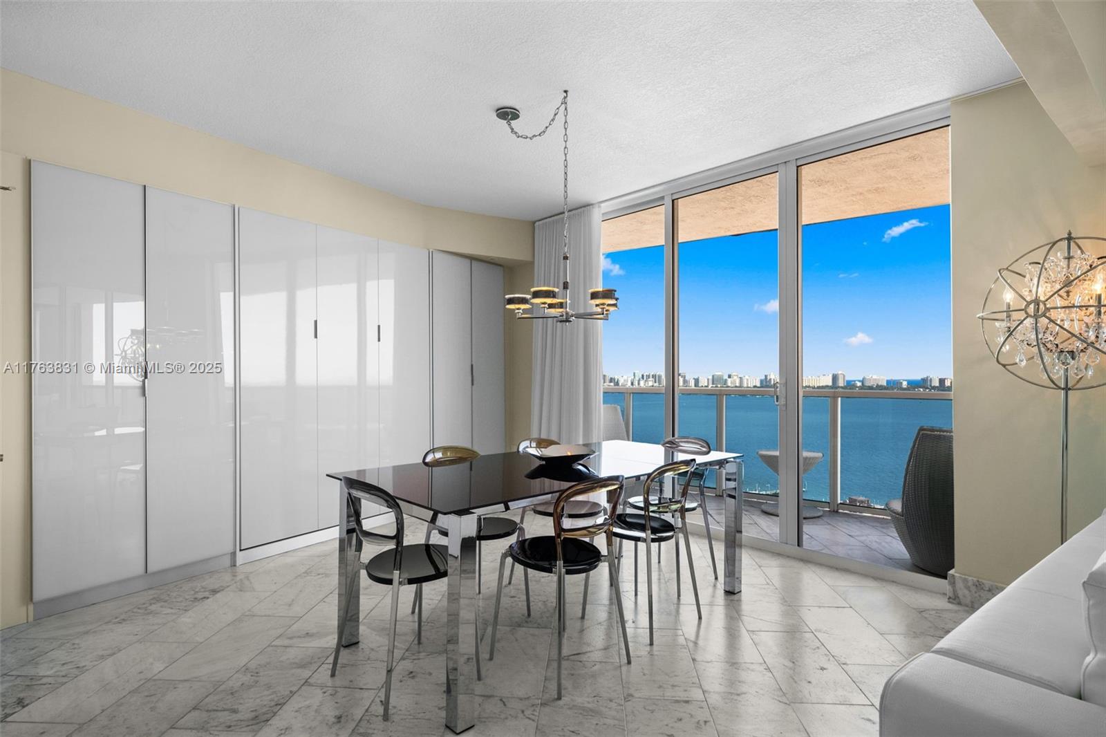 1881 79th Street Causeway, Unit 1906 North Bay Village, FL 33141 - Photo 6 of 39 Dining table can be remove to put back the original space for the second guest bedroom