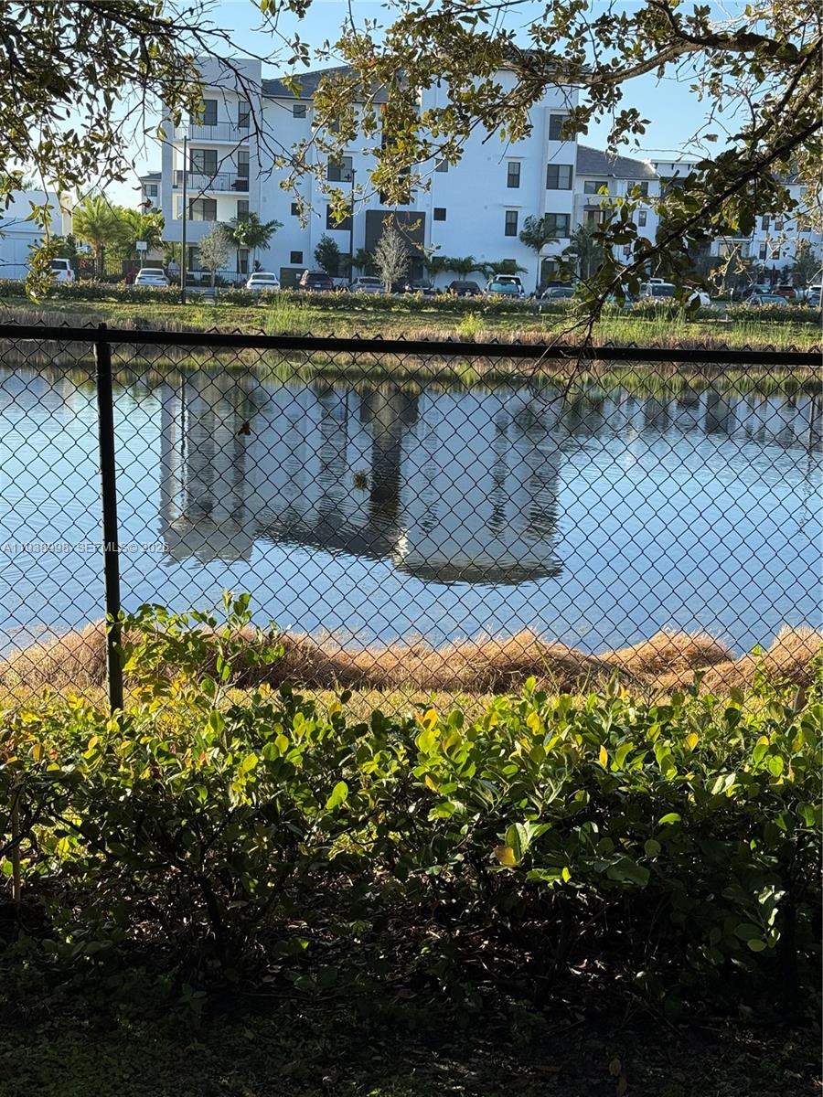 12260 Southwest 27th Street, Unit 1303 Miramar, FL 33025 - Photo 3 of 58 a view of a lake from a balcony
