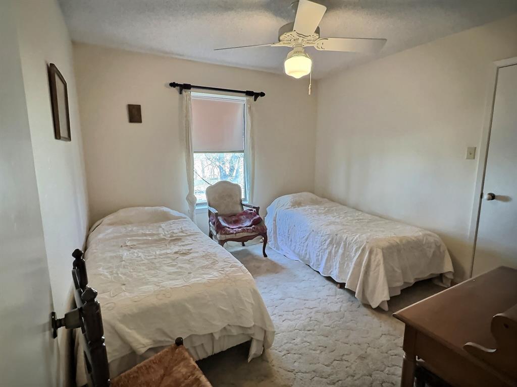 3718 Highway 36 Rising Star, TX 76471 - Photo 23 of 40 a bedroom with bed and a window