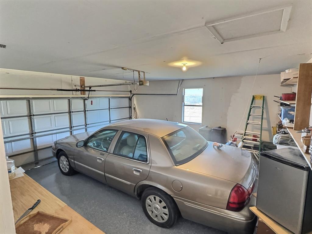 3718 Highway 36 Rising Star, TX 76471 - Photo 28 of 40 a view of a car parked in garage