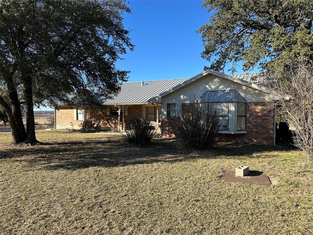 3718 Highway 36 Rising Star, TX 76471 - Photo 3 of 40 a front view of a house with a yard