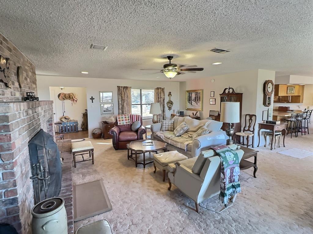 3718 Highway 36 Rising Star, TX 76471 - Photo 10 of 40 a living room with furniture and a fireplace