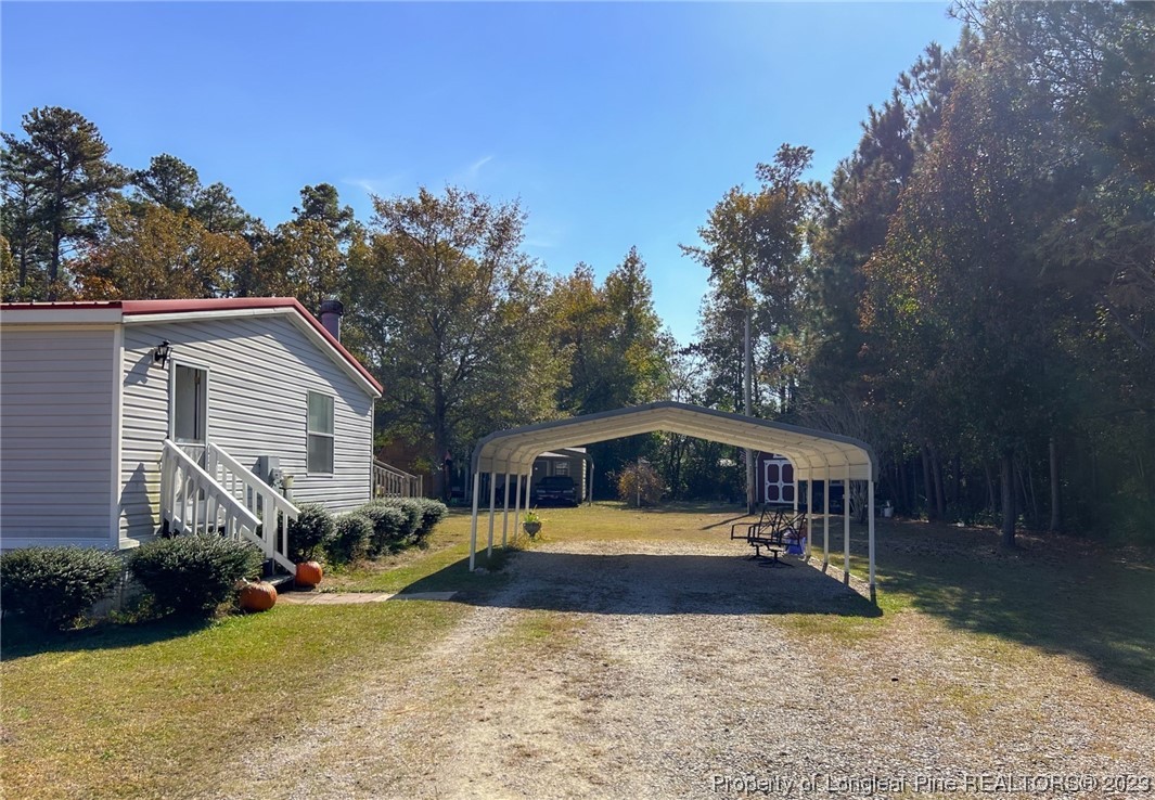 259 Burch Road Lumberton, NC 28360 - Photo 3 of 13 a view of a house with a yard