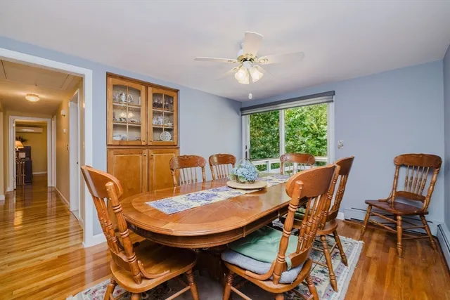a kitchen with granite countertop kitchen island stainless steel appliances a table and chairs in it