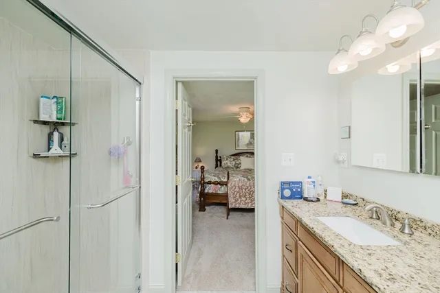 a bathroom with a shower and a toilet