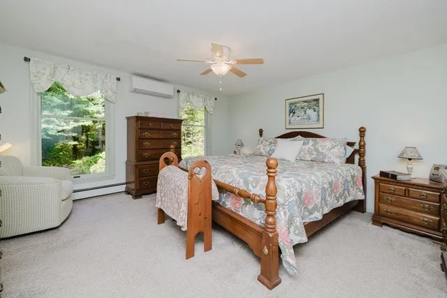 a bed room with a bed and a chandelier