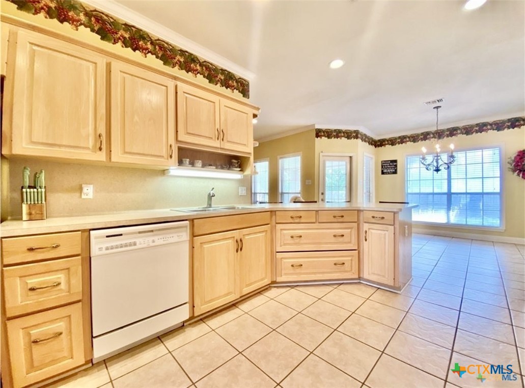 415 South Trinity Street Edna, TX 77957 - Photo 14 of 46 a kitchen with stainless steel appliances granite countertop a sink and cabinets