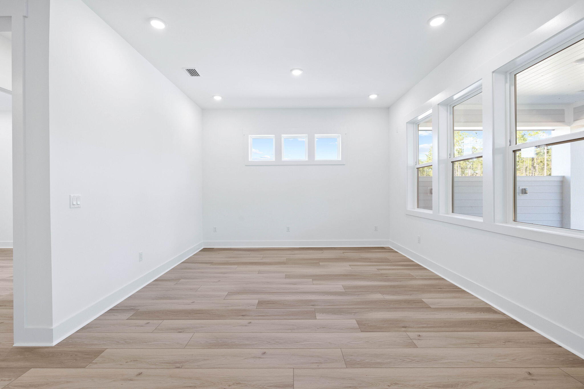 2488 Pathways Dr Inlet Beach Inlet Beach, FL 32461 - Photo 14 of 35 a view of an empty room with wooden floor and a window