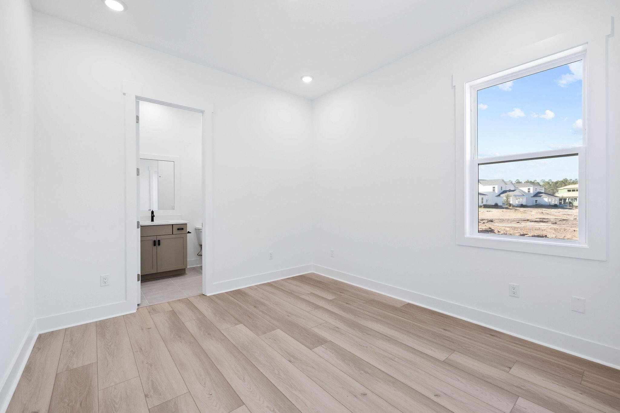 2488 Pathways Dr Inlet Beach Inlet Beach, FL 32461 - Photo 22 of 35 an empty room with a window and wooden floor