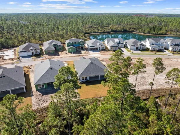 an aerial view of a house with outdoor space