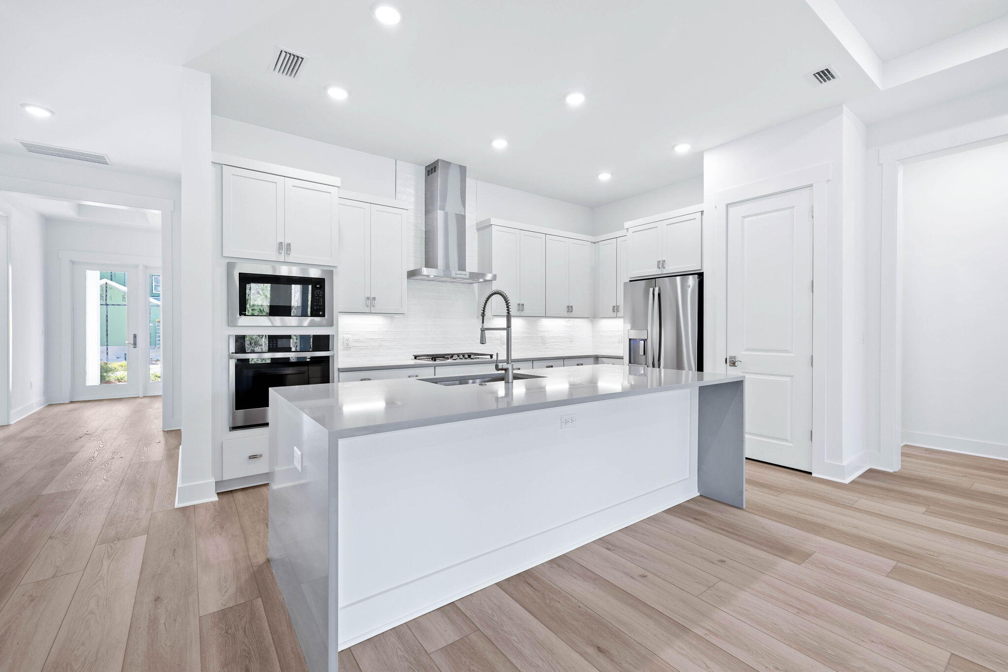 2488 Pathways Dr Inlet Beach Inlet Beach, FL 32461 - Photo 6 of 35 a kitchen with stainless steel appliances granite countertop a refrigerator oven a sink dishwasher and white cabinets with wooden floor