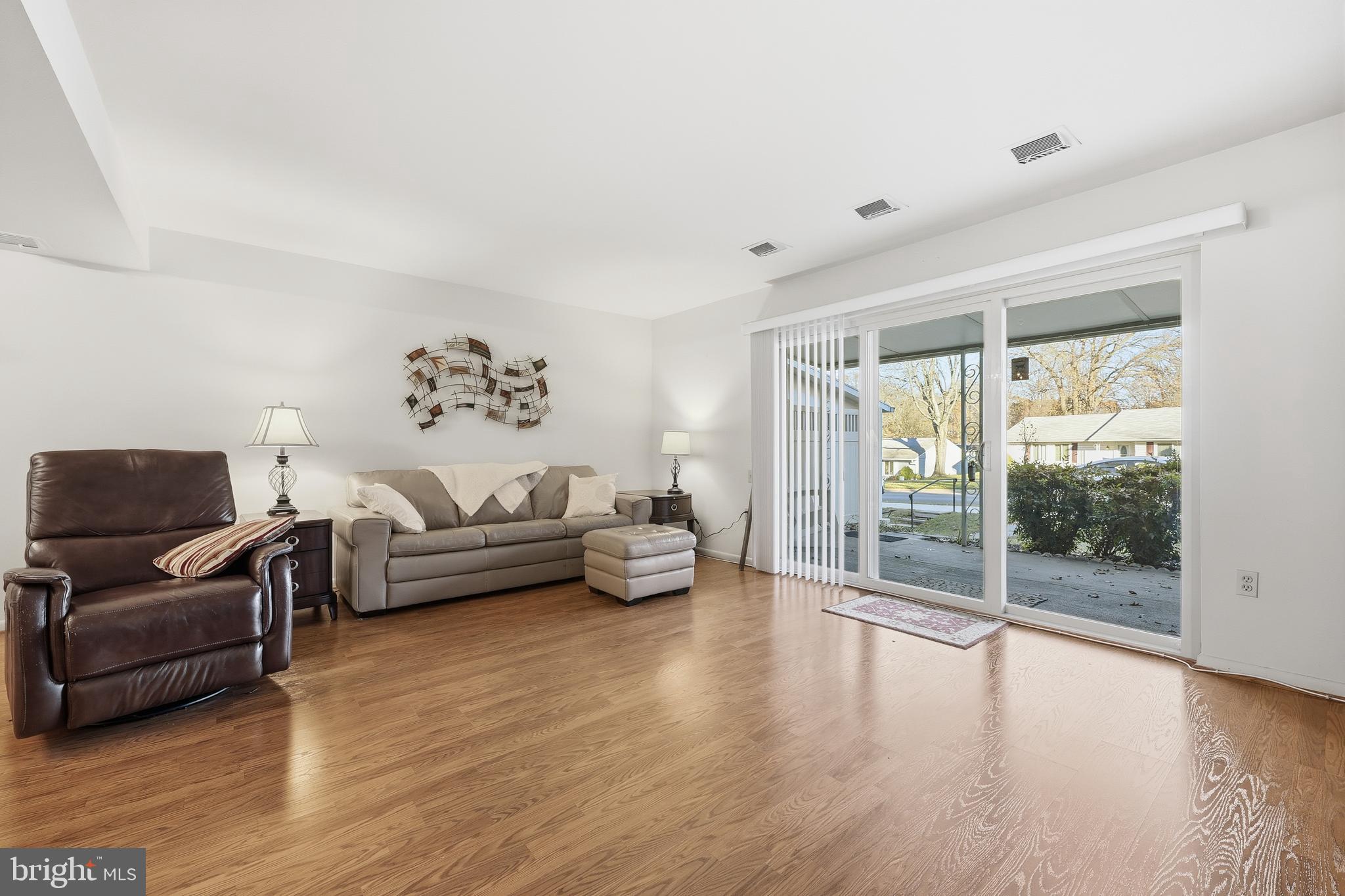 3345 North Leisure World Boulevard, Unit 96J Silver Spring, MD 20906 - Photo 12 of 50 a living room with furniture and a large window