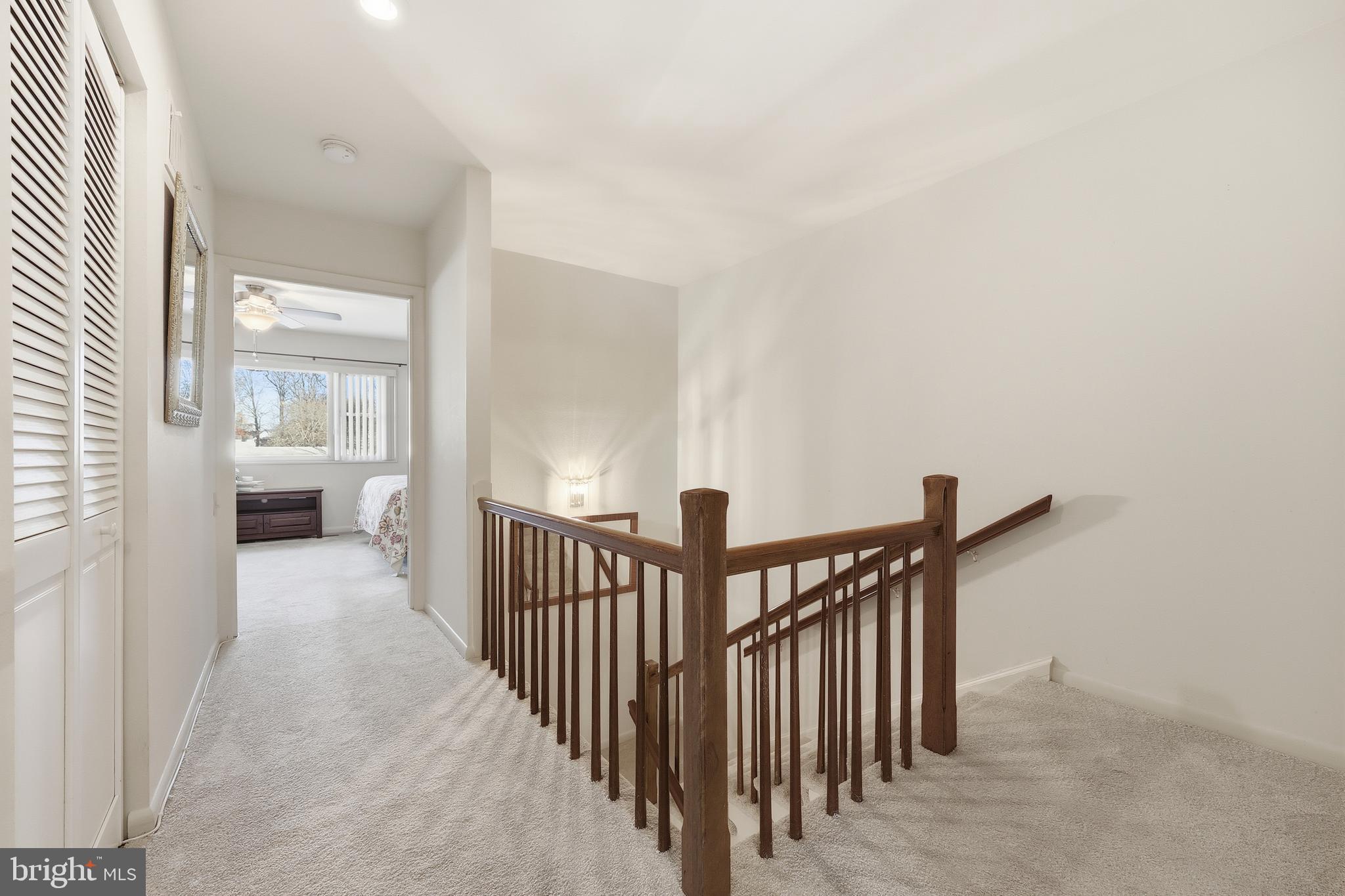 3345 North Leisure World Boulevard, Unit 96J Silver Spring, MD 20906 - Photo 18 of 50 a view of a hallway with a livingroom and furniture