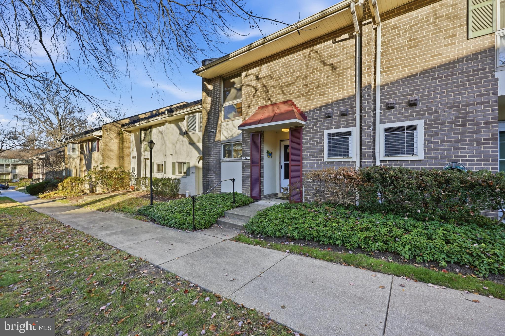 3345 North Leisure World Boulevard, Unit 96J Silver Spring, MD 20906 - Photo 25 of 50 a view of a house with a yard