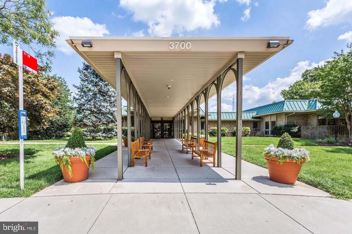 3345 North Leisure World Boulevard, Unit 96J Silver Spring, MD 20906 - Photo 29 of 50 a view of a patio with chairs and a potted plants