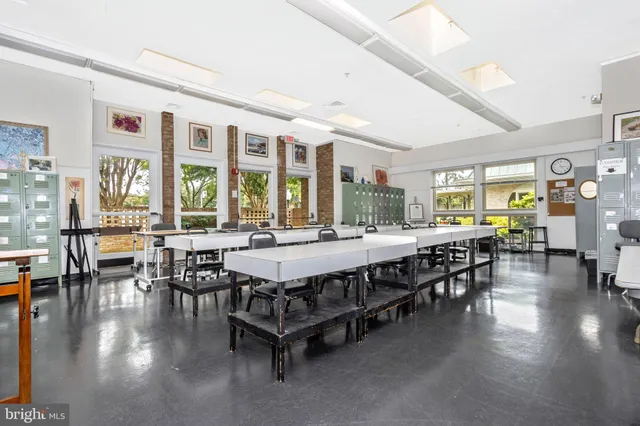 a room with furniture and soccer shelves