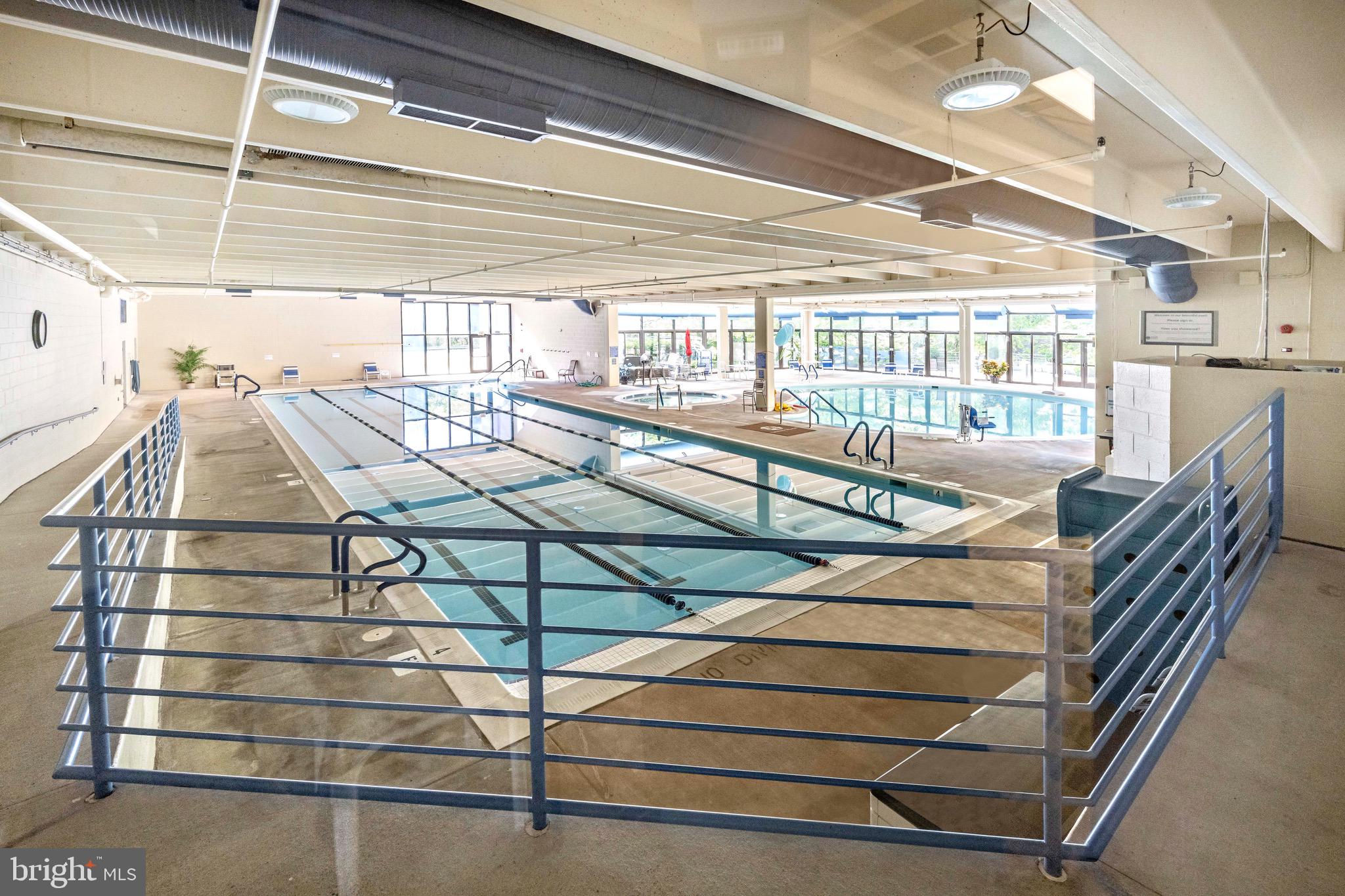 3345 North Leisure World Boulevard, Unit 96J Silver Spring, MD 20906 - Photo 44 of 50 a view of a chairs and table on the balcony