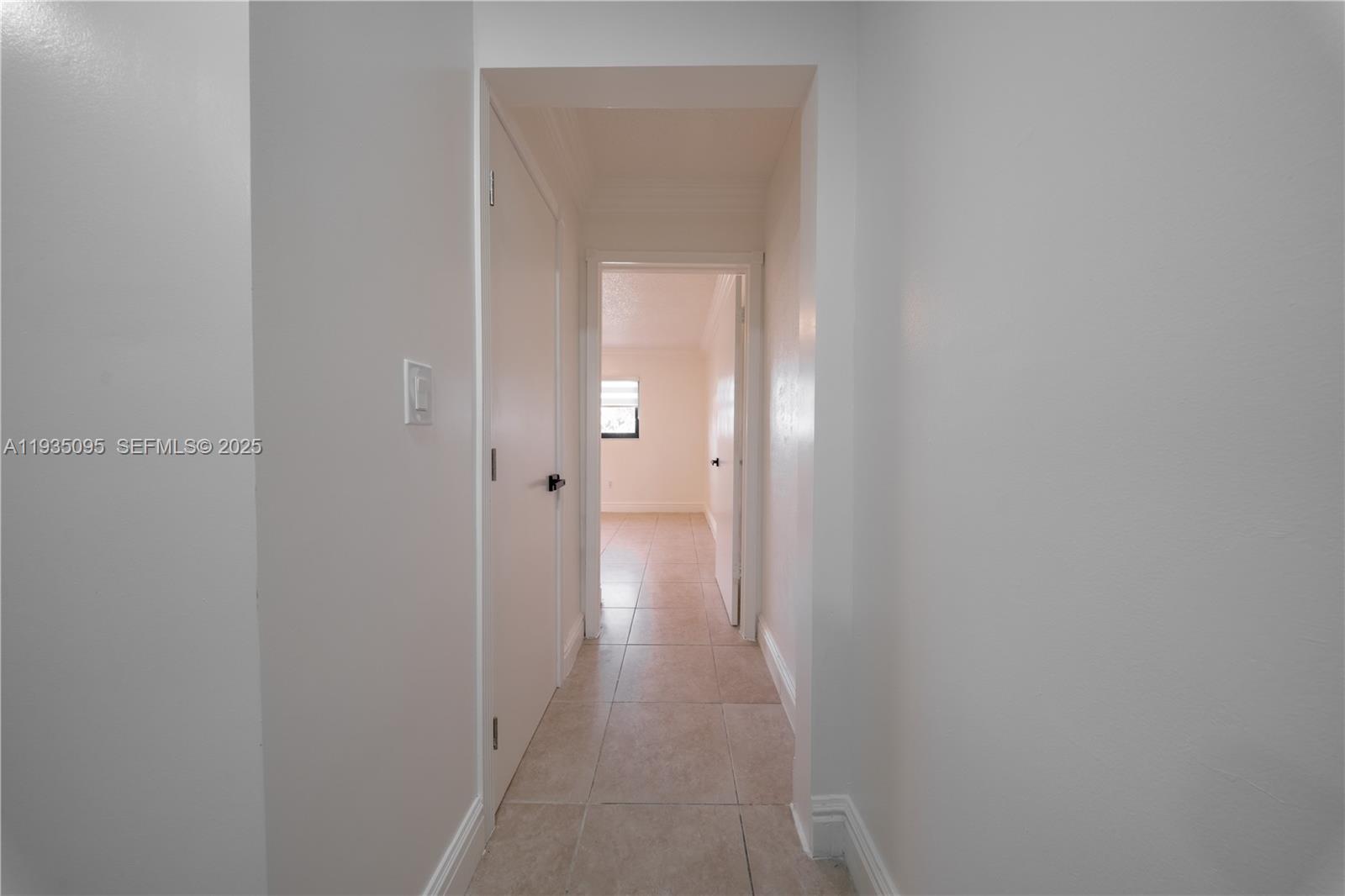 3219 Southwest 141st Avenue, Unit 1 Miami, FL 33175 - Photo 7 of 17 a view of a hallway with wooden floor