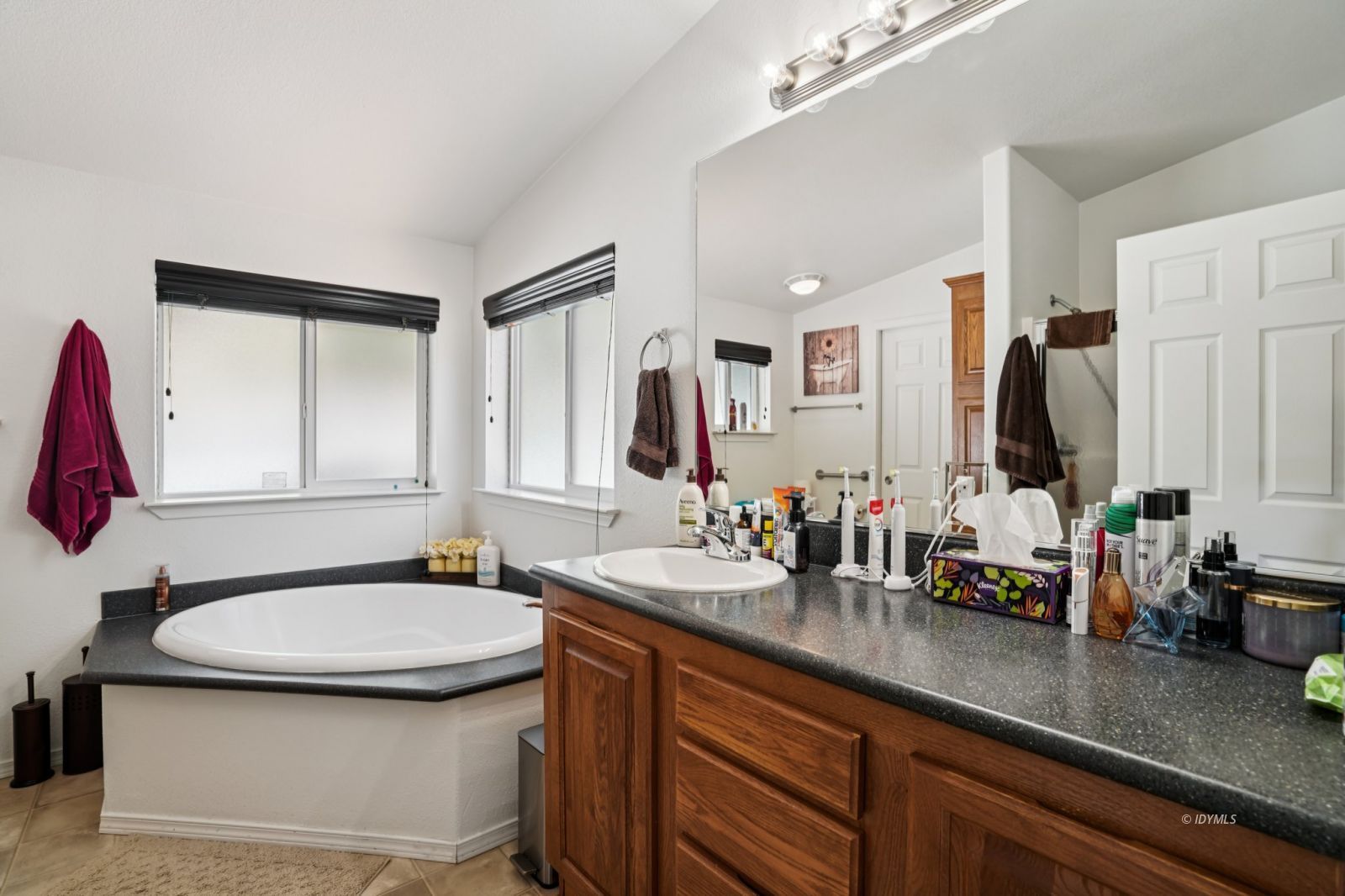 25001 Rim Rock Road Idyllwild, CA 92549 - Photo 31 of 50 a bathroom with a granite countertop sink and a mirror