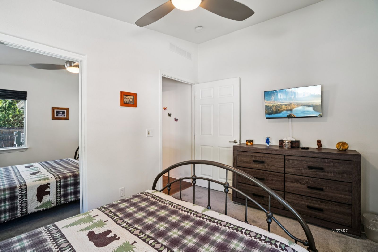 25001 Rim Rock Road Idyllwild, CA 92549 - Photo 37 of 50 a bedroom with a bed and a flat screen tv