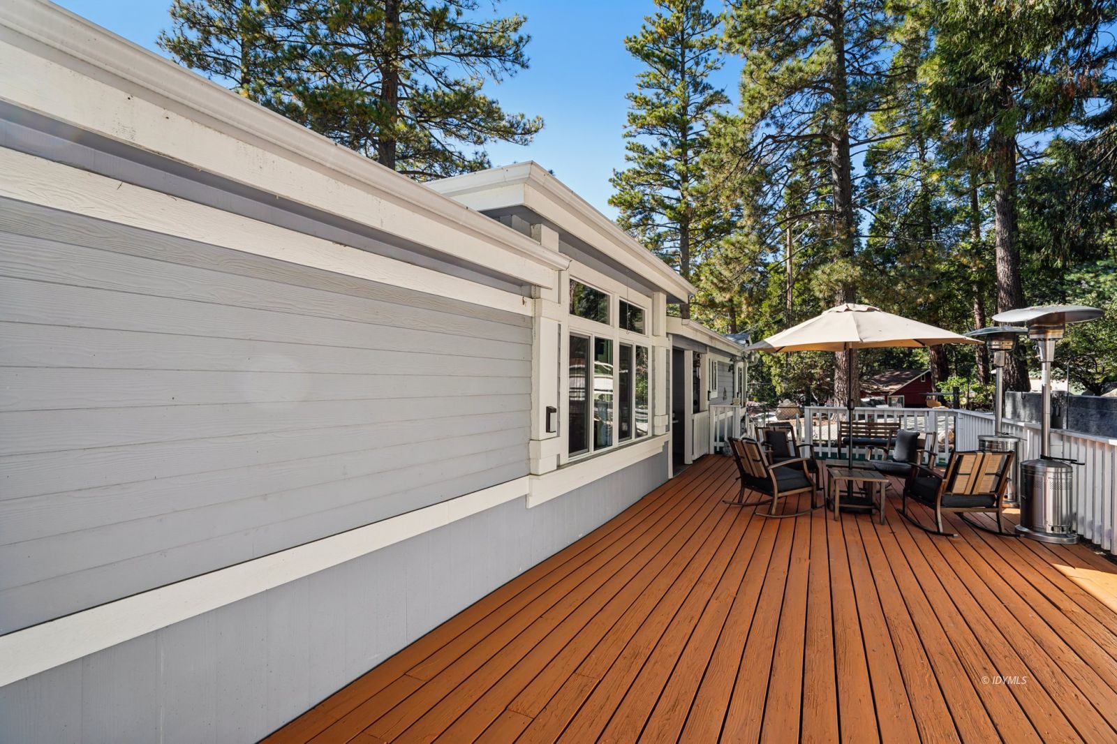 25001 Rim Rock Road Idyllwild, CA 92549 - Photo 42 of 50 a balcony with wooden floor and outdoor seating