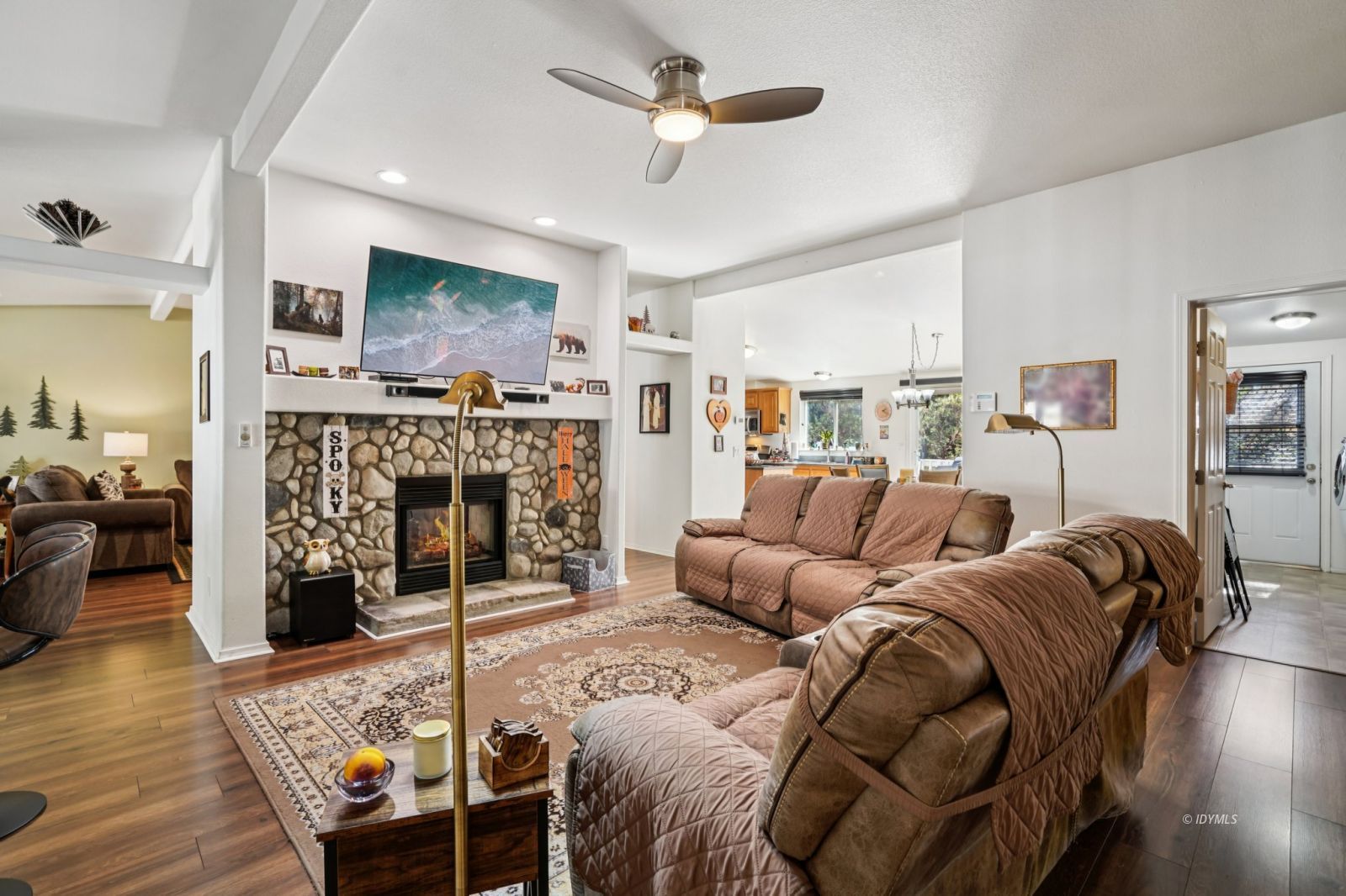 25001 Rim Rock Road Idyllwild, CA 92549 - Photo 10 of 50 a living room with furniture a flat screen tv and a fireplace