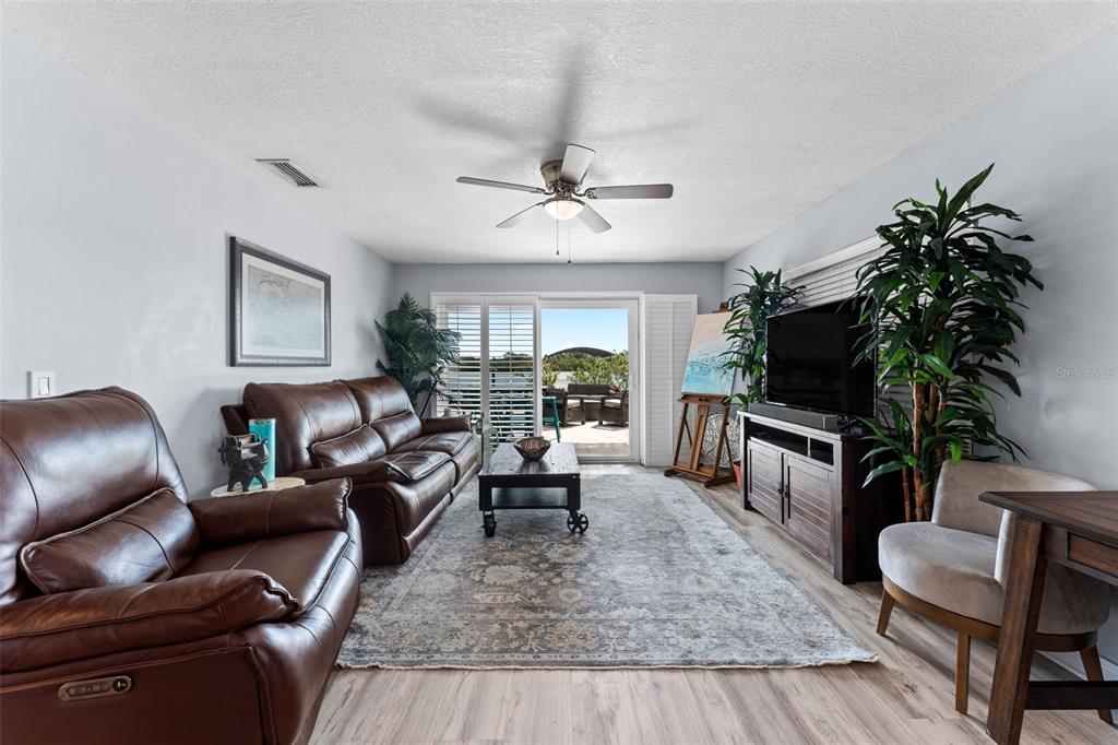 29 Pelican Lane Edgewater, FL 32141 - Photo 12 of 39 a living room with furniture potted plant and a window