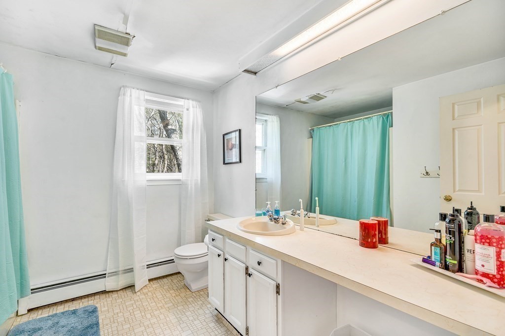 36 Autumn Road Lunenburg, MA 01462 - Photo 17 of 29 a bathroom with a double vanity sink toilet and a mirror