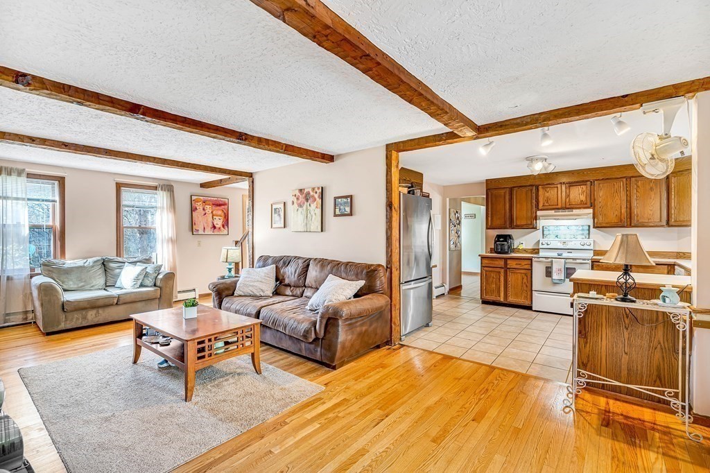 36 Autumn Road Lunenburg, MA 01462 - Photo 6 of 29 a living room with furniture and a wooden floor