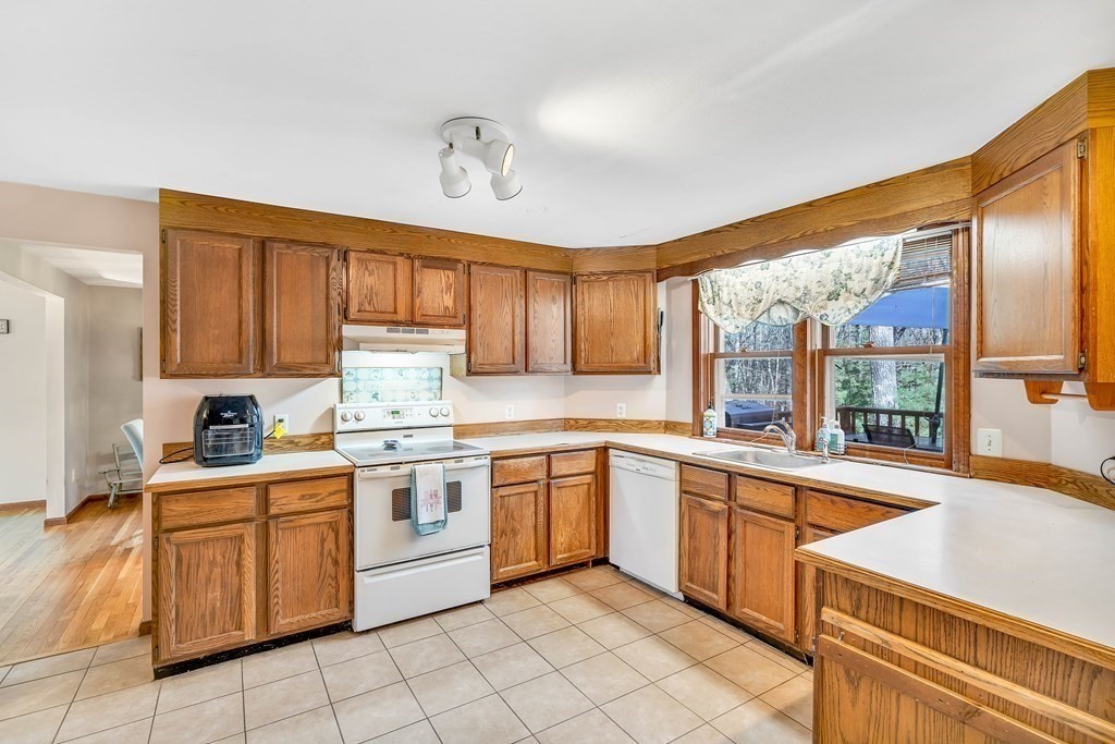 36 Autumn Road Lunenburg, MA 01462 - Photo 8 of 29 a kitchen with a stove a sink and cabinets