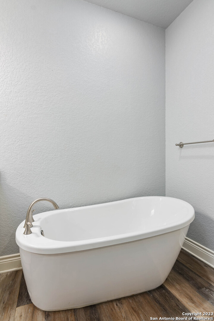 230 Club View West Seguin, TX 78155 - Photo 15 of 24 a white tub sitting next to a white sink