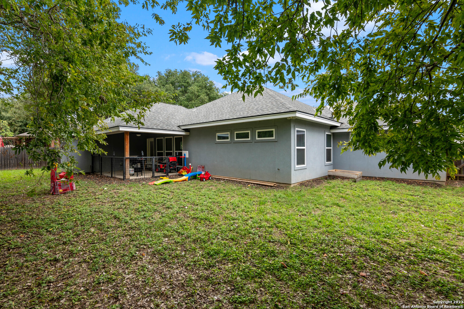 230 Club View West Seguin, TX 78155 - Photo 22 of 24 a backyard of a house with table and chairs