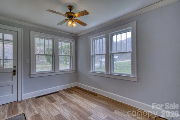a view of an empty room with a window