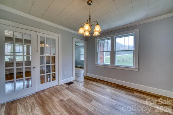 a view of windows and chandelier in a room