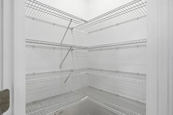 a view of a room with racks on the wall