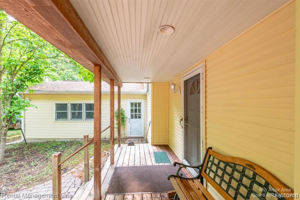 7870 Chamberlin Road Dexter, MI 48130 - Photo 43 of 52 Covered porch with wood-finish decking and ceiling