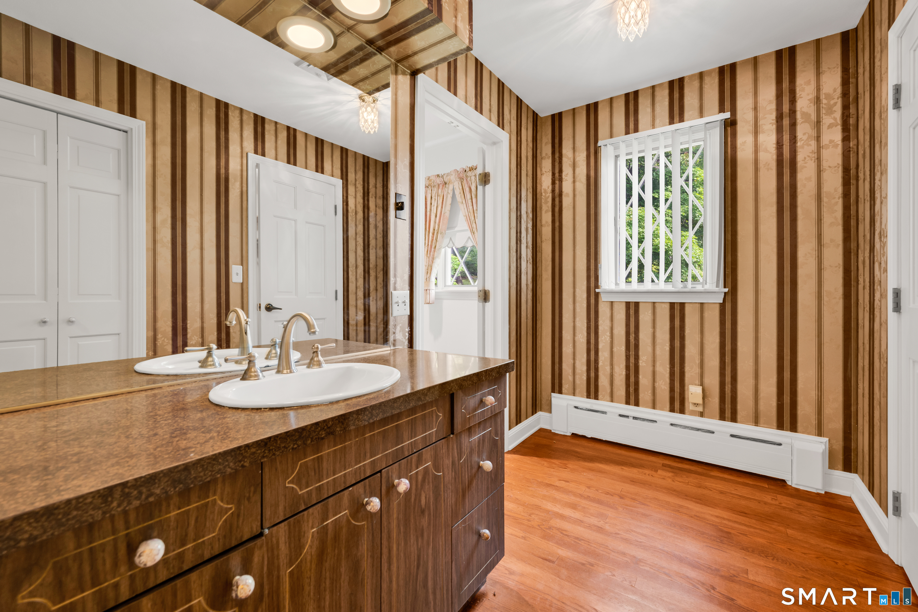 232 Maybrook Road Waterbury, CT 06708 - Photo 25 of 38 a spacious bathroom with a mirror a sink and a shower