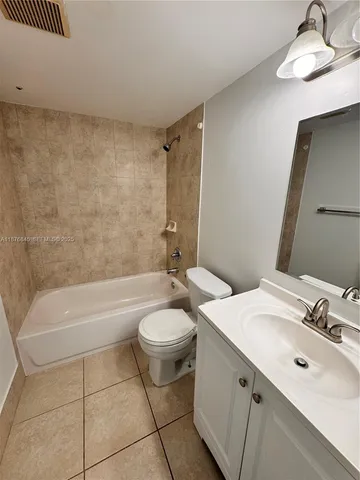 a bathroom with a sink a toilet and bathtub