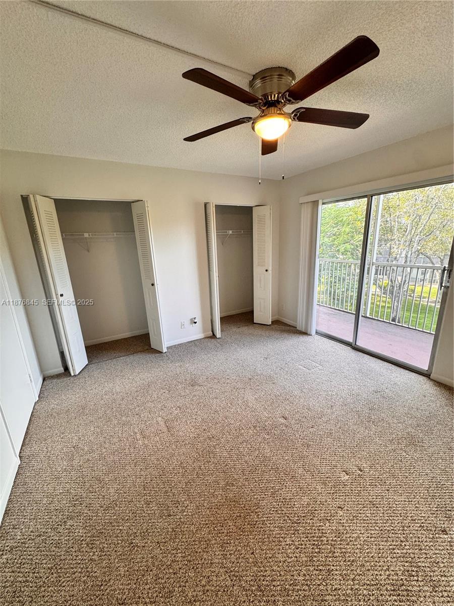 13355 Southwest 9th Court, Unit 310H Pembroke Pines, FL 33027 - Photo 17 of 30 a view of a livingroom with a ceiling fan and window