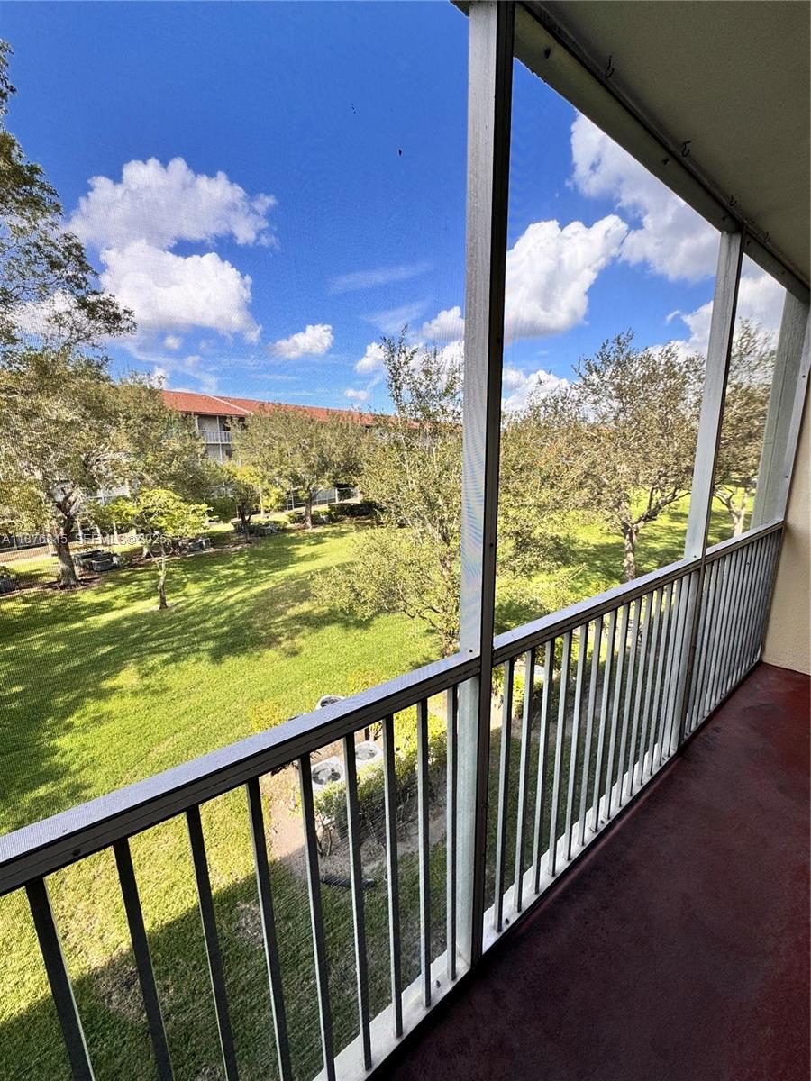 13355 Southwest 9th Court, Unit 310H Pembroke Pines, FL 33027 - Photo 20 of 30 a view of city from a balcony