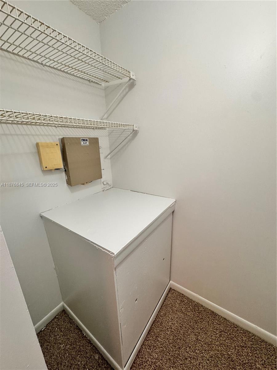 13355 Southwest 9th Court, Unit 310H Pembroke Pines, FL 33027 - Photo 24 of 30 a utility room with dryer and washer