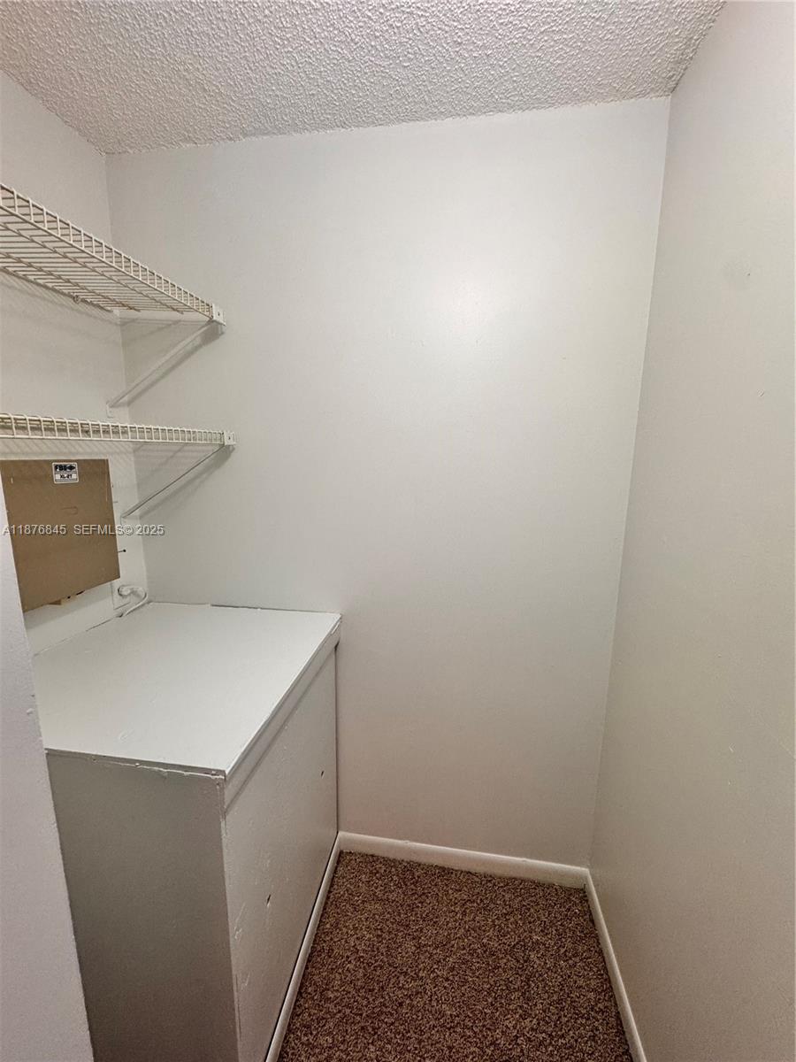 13355 Southwest 9th Court, Unit 310H Pembroke Pines, FL 33027 - Photo 25 of 30 a utility room with dryer and washer