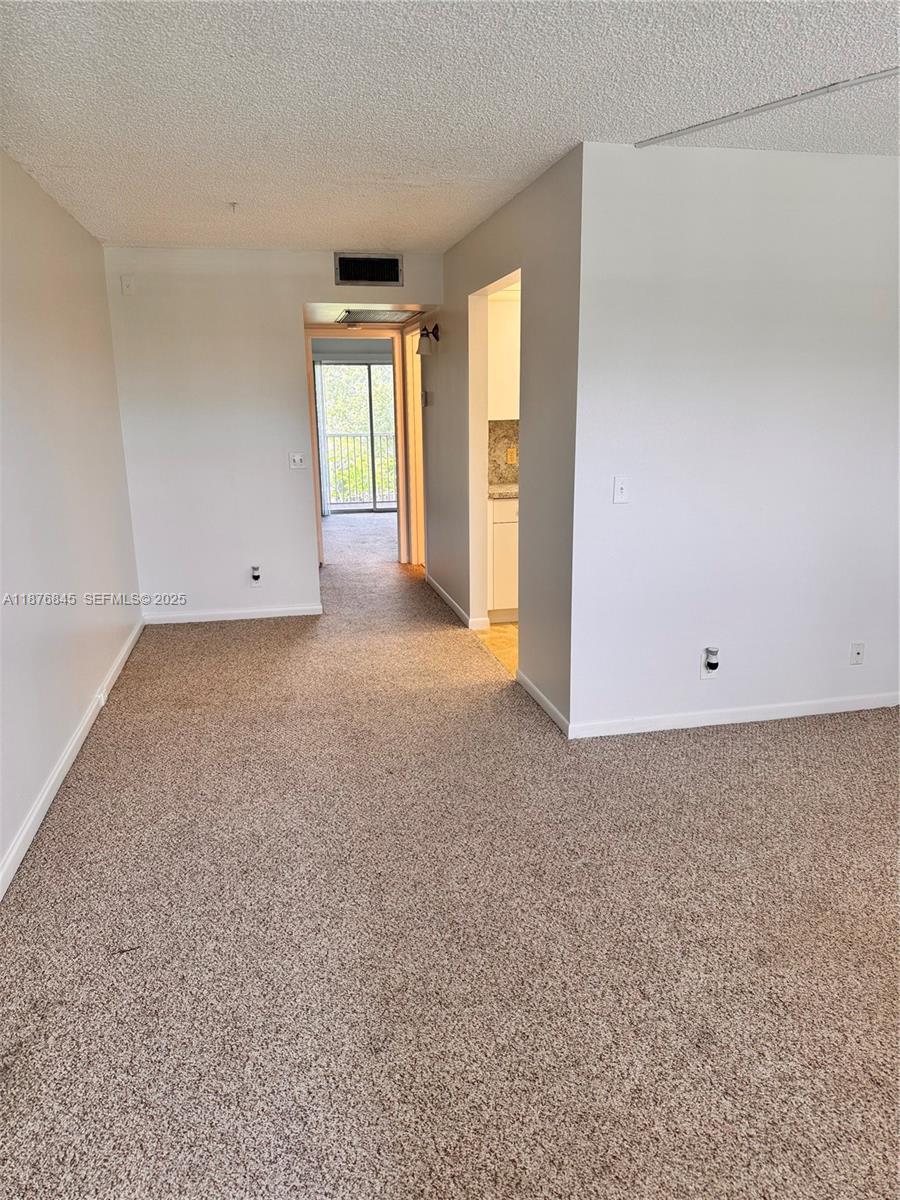 13355 Southwest 9th Court, Unit 310H Pembroke Pines, FL 33027 - Photo 6 of 30 a view of an empty room with a window