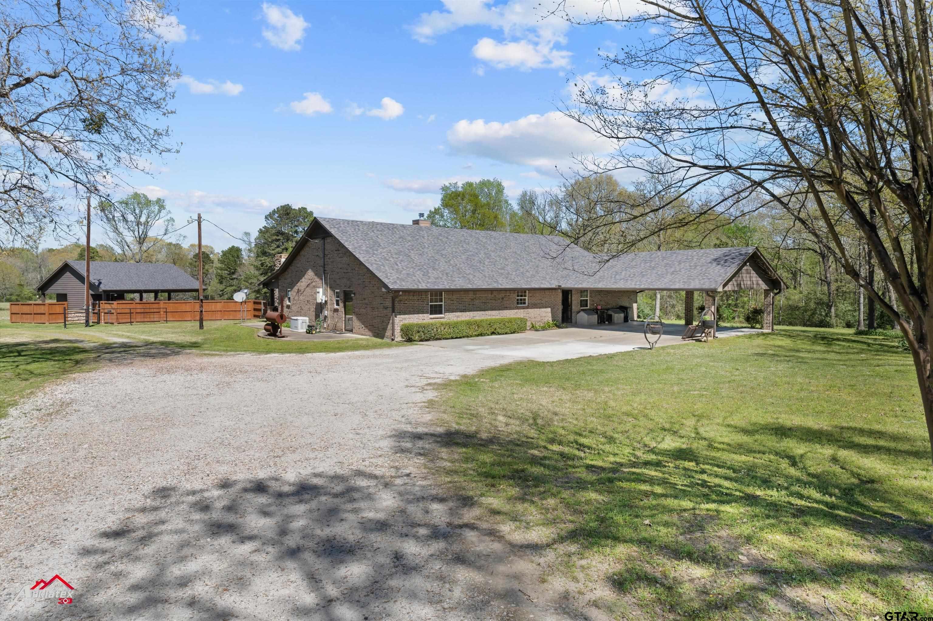 2150 County Road 121 Gary, TX 75643 - Photo 1 of 35 a view of house with outdoor space and sitting area