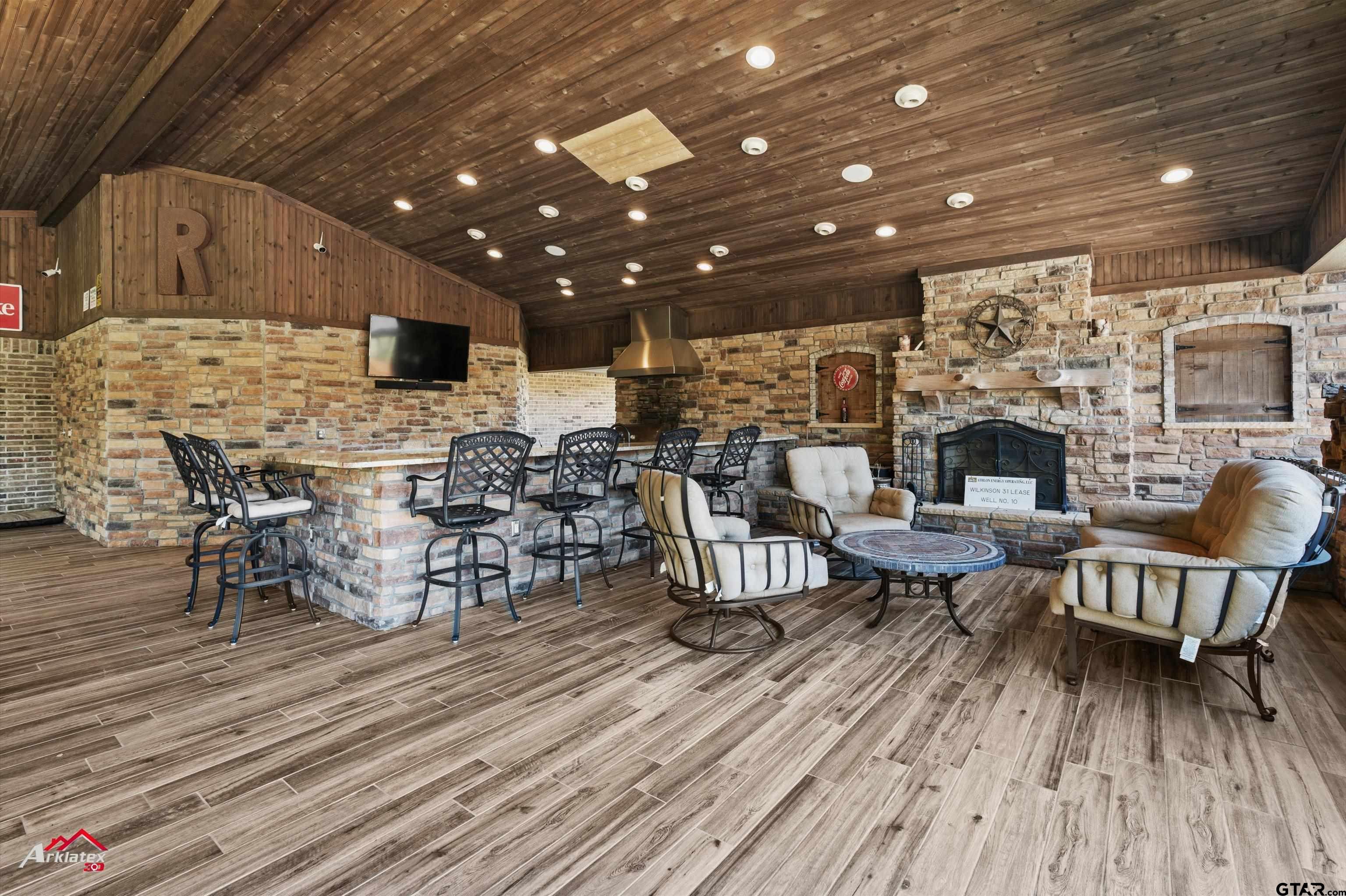 2150 County Road 121 Gary, TX 75643 - Photo 22 of 35 a living room with lots of furniture and a wooden floor