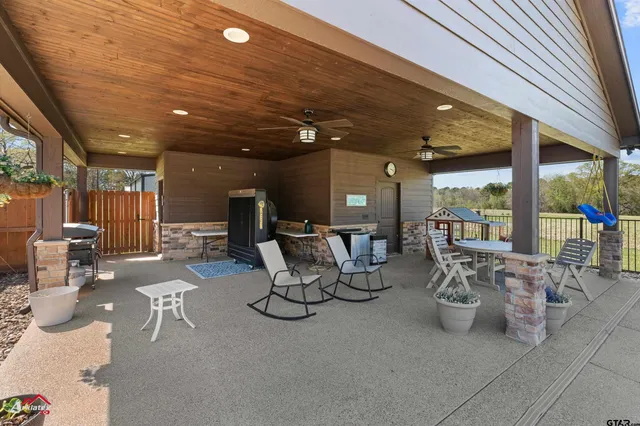 a group of people sitting in patio of a building