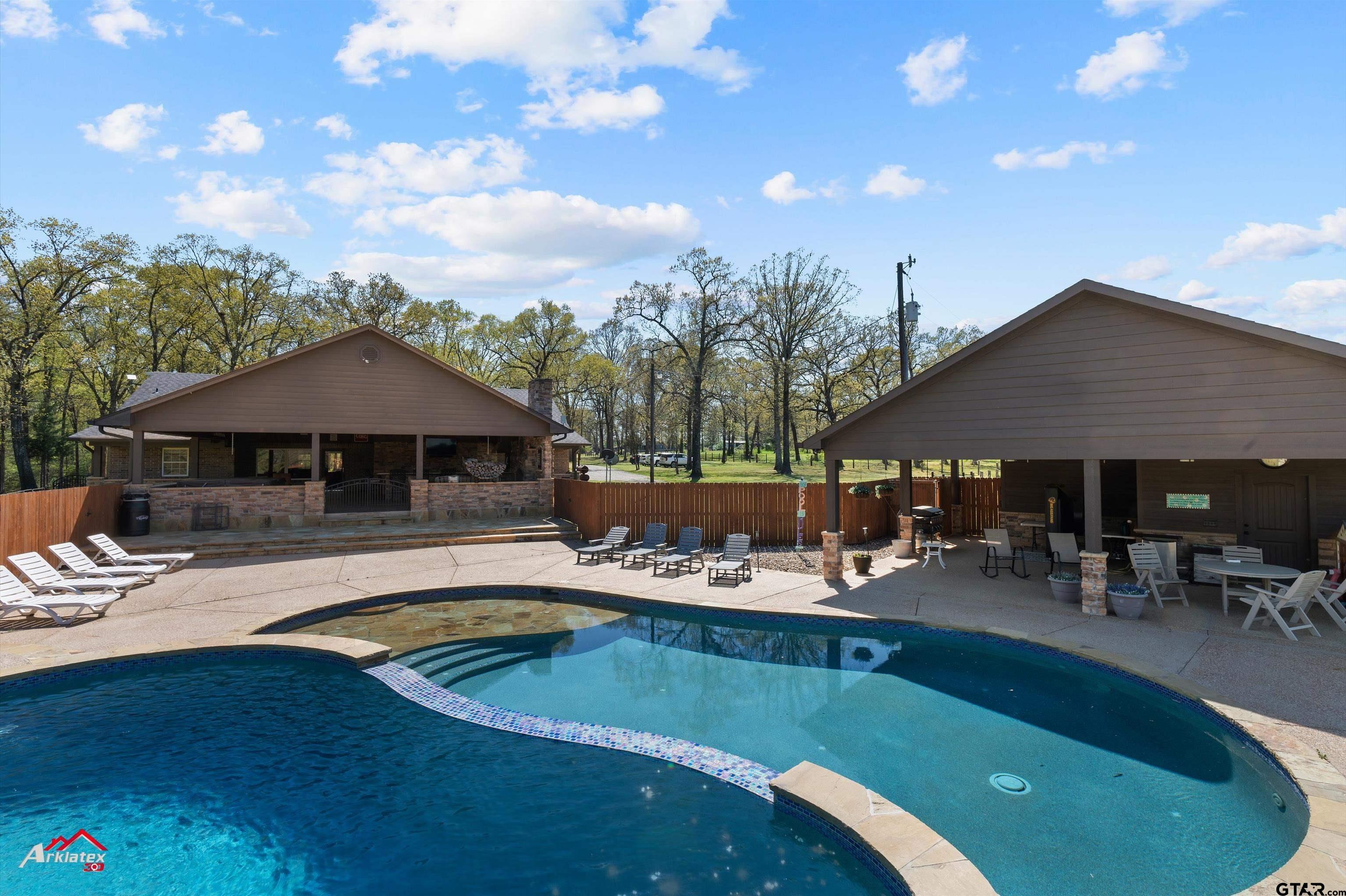 2150 County Road 121 Gary, TX 75643 - Photo 28 of 35 a view of a house with swimming pool and sitting area