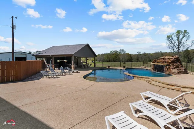 a view of a patio with chairs and plants