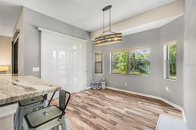 a kitchen with kitchen island a window and appliances