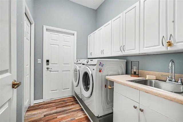 a bedroom with bed and wooden floor
